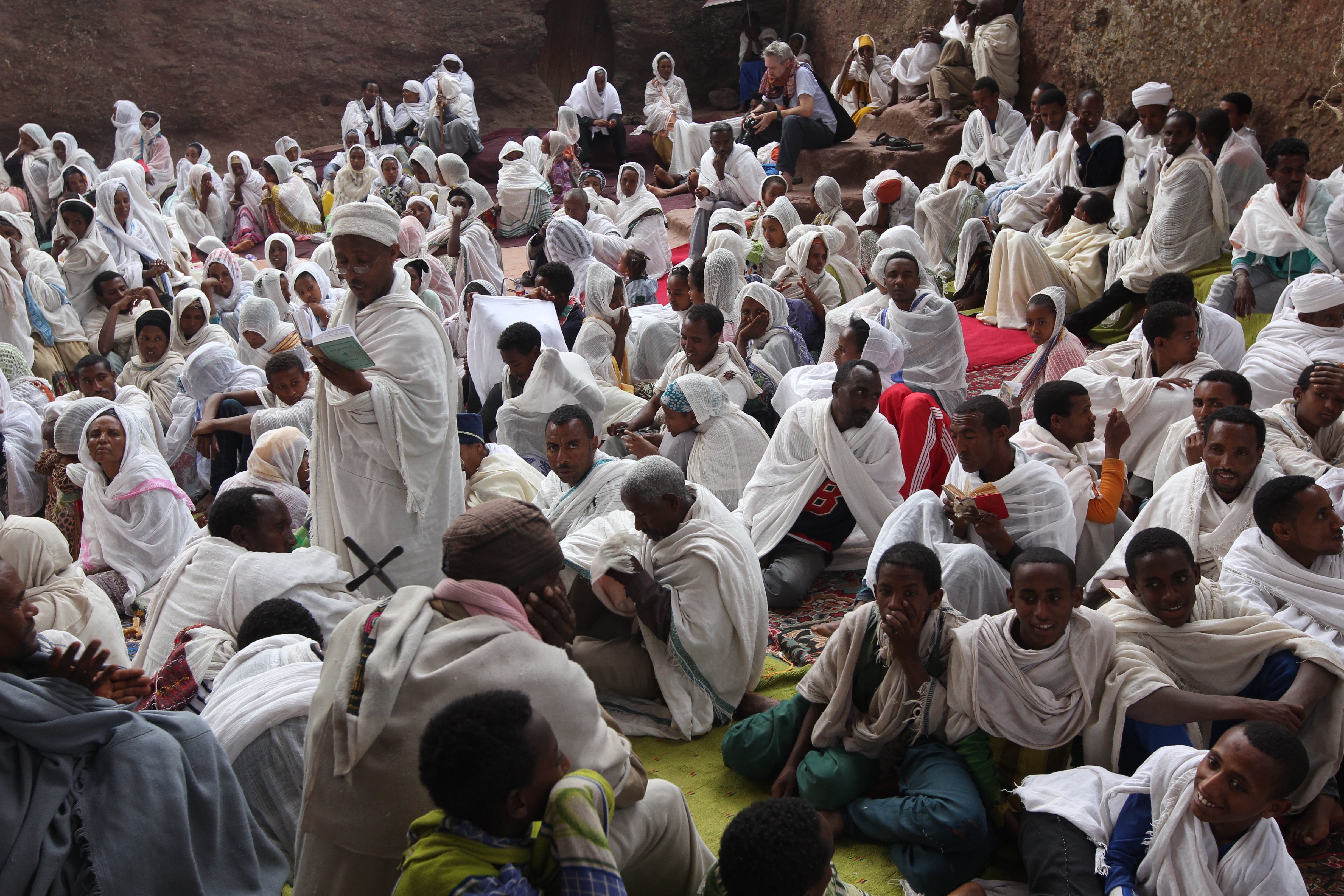 A family celebrating Fasika (Ethiopian Easter) with a traditional feast.